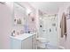 Bright bathroom featuring a glass door shower, modern vanity, and stylish decor in a charming home at 424 Lake Point Trce, Canton, GA 30114