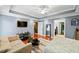 Comfortable bedroom with hardwood floors, a seating area, and access to a bathroom and closet at 424 Lake Point Trce, Canton, GA 30114