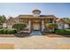 Charming clubhouse featuring a stone facade, covered entryway, and meticulously landscaped grounds at 424 Lake Point Trce, Canton, GA 30114