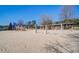 Vibrant community playground with play structures, slides, and swings amidst a sandy play area at 424 Lake Point Trce, Canton, GA 30114