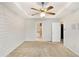 Bright main bedroom with ceiling fan, en suite bathroom and shiplap wall at 75 Crestview Dr, Dallas, GA 30157