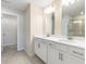 Double vanity bathroom with walk-in shower and separate closet at 214 Wilder Ridge Way, Lawrenceville, GA 30044