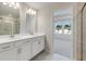 Bathroom with double vanity and access to bedroom at 214 Wilder Ridge Way, Lawrenceville, GA 30044