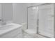 Bathroom with toilet, sink, and glass shower at 214 Wilder Ridge Way, Lawrenceville, GA 30044