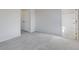 Spacious bedroom with neutral carpeting and access to bathroom at 214 Wilder Ridge Way, Lawrenceville, GA 30044