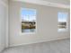 Spacious bedroom with large windows and neutral carpeting at 214 Wilder Ridge Way, Lawrenceville, GA 30044