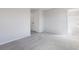 Spacious bedroom with grey carpet and access to closets and hallway at 214 Wilder Ridge Way, Lawrenceville, GA 30044