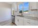 White shaker cabinets, granite countertops and stainless steel dishwasher at 214 Wilder Ridge Way, Lawrenceville, GA 30044