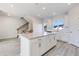 Island kitchen with white cabinets and granite countertops at 214 Wilder Ridge Way, Lawrenceville, GA 30044