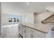 Open concept kitchen with island and living area at 214 Wilder Ridge Way, Lawrenceville, GA 30044