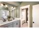 Spa-like bathroom with double vanity, large mirror, and a separate tub/shower room at 723 Crossroad Ct, Powder Springs, GA 30127