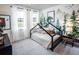 bedroom features themed wallpaper, modern furniture, and bright natural light at 723 Crossroad Ct, Powder Springs, GA 30127