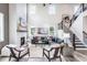 Bright living room features a fireplace, hardwood floors, and staircase at 723 Crossroad Ct, Powder Springs, GA 30127