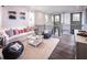 Cozy loft area with soft white sofa, pillows, beanbag chairs, and bright natural light at 723 Crossroad Ct, Powder Springs, GA 30127