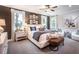 Relaxing main bedroom with a large bed, ambient lighting, and bright windows at 723 Crossroad Ct, Powder Springs, GA 30127