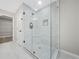 Large walk-in shower with marble tile and glass enclosure at 4352 Riverlake Way, Snellville, GA 30039