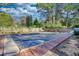 Residential pool with cover and brick decking at 1594 Harbour Oaks Rd, Tucker, GA 30084