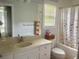 Bathroom featuring single vanity and shower-tub combo, offering comfort and style at 815 Sylvan Dr, Marietta, GA 30066