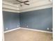 Bedroom with neutral carpet and ceiling fan, combining comfort with modern design at 815 Sylvan Dr, Marietta, GA 30066
