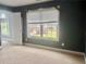 Bedroom with neutral carpet and stylish decor, offering a cozy and inviting space at 815 Sylvan Dr, Marietta, GA 30066