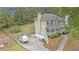 Charming two-story home with a front porch, two-car garage, and a well-maintained yard with mature trees at 815 Sylvan Dr, Marietta, GA 30066