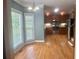 Open-concept kitchen with stainless steel appliances, wooden cabinets, and hardwood floors at 815 Sylvan Dr, Marietta, GA 30066