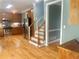 Spacious kitchen featuring stainless steel appliances, wooden cabinets, and a staircase at 815 Sylvan Dr, Marietta, GA 30066