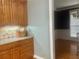 Elegant kitchen featuring wooden cabinets, granite countertops, and hardwood floors at 815 Sylvan Dr, Marietta, GA 30066