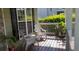 Inviting front porch with comfortable seating, plants, and natural light at 815 Sylvan Dr, Marietta, GA 30066