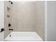 Bathroom with a shower/tub combo and neutral tile at 320 Gray Shingle Ln, Woodstock, GA 30189