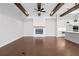 Spacious living room featuring hardwood floors and a fireplace at 320 Gray Shingle Ln, Woodstock, GA 30189