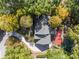 Aerial perspective showcases the home's roofline, surrounding mature trees, and convenient driveway layout at 7300 Chattahoochee Bluff Dr, Atlanta, GA 30350