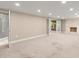 Spacious basement with a walk-in shower, fireplace and multiple doors at 7300 Chattahoochee Bluff Dr, Atlanta, GA 30350