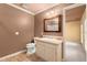 Bathroom with pink walls, and a view of the vanity and sink area with a view into the main bedroom at 7300 Chattahoochee Bluff Dr, Atlanta, GA 30350