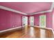 Bright bedroom with hardwood floors, neutral walls, and multiple windows for natural light at 7300 Chattahoochee Bluff Dr, Atlanta, GA 30350