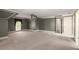 Spacious carpeted bedroom features neutral walls, white trim, a ceiling fan, and an abundance of natural light at 7300 Chattahoochee Bluff Dr, Atlanta, GA 30350