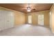 Large bedroom with light tan walls, two windows with window coverings and a closet with bi-fold doors at 7300 Chattahoochee Bluff Dr, Atlanta, GA 30350