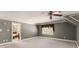 Carpeted bedroom features neutral walls, white trim, and adjoins bathroom, offering ample room for furniture and relaxation at 7300 Chattahoochee Bluff Dr, Atlanta, GA 30350