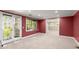 Bright bedroom with double doors to the exterior and neutral carpet at 7300 Chattahoochee Bluff Dr, Atlanta, GA 30350