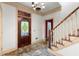 Foyer showcasing the staircase, an elegant front door, and natural light at 7300 Chattahoochee Bluff Dr, Atlanta, GA 30350