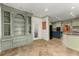 Bright kitchen with open floorplan, custom cabinets, and stainless appliances at 7300 Chattahoochee Bluff Dr, Atlanta, GA 30350