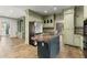 Spacious kitchen featuring custom cabinets, granite countertops and stainless steel refrigerator at 7300 Chattahoochee Bluff Dr, Atlanta, GA 30350