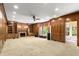Bright living room with fireplace, built-in shelving and large windows providing natural light at 7300 Chattahoochee Bluff Dr, Atlanta, GA 30350