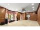 Spacious living room features wood paneling, large windows, and abundant natural light at 7300 Chattahoochee Bluff Dr, Atlanta, GA 30350