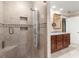 Elegant bathroom with marble shower, custom fixtures, and wood cabinets at 7300 Chattahoochee Bluff Dr, Atlanta, GA 30350