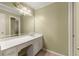 This dressing area features a white vanity with drawers and cabinets, and a lighted makeup mirror at 7300 Chattahoochee Bluff Dr, Atlanta, GA 30350
