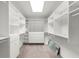 Large walk-in closet features custom shelving, drawers, and ample storage space for organization at 7300 Chattahoochee Bluff Dr, Atlanta, GA 30350