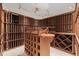 Well-organized custom wine cellar with ample storage and display lighting at 7300 Chattahoochee Bluff Dr, Atlanta, GA 30350