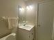 Bathroom featuring a single sink vanity, mirror and towel rack at 2787 Heritage Ln, Morrow, GA 30260