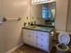 Vintage bathroom featuring a single sink vanity with storage, a mirror, and a toilet at 2787 Heritage Ln, Morrow, GA 30260